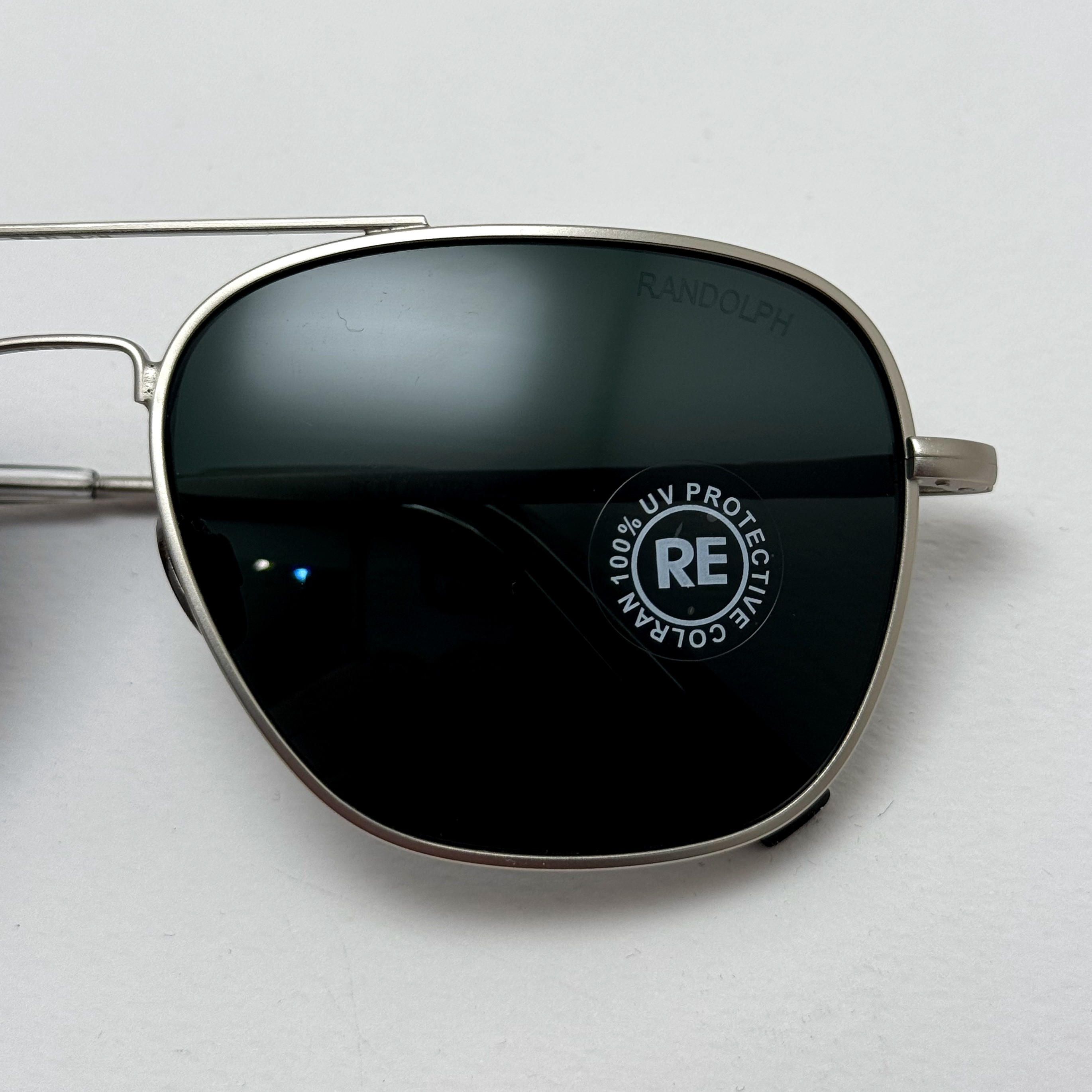 عینک آفتابی خلبانی رندولف شیشه سنگ آنتی رفلکس مشکی نقره ای فول پک RANDOLPH AVIATOR RE 58 24K WHITE GOLD
