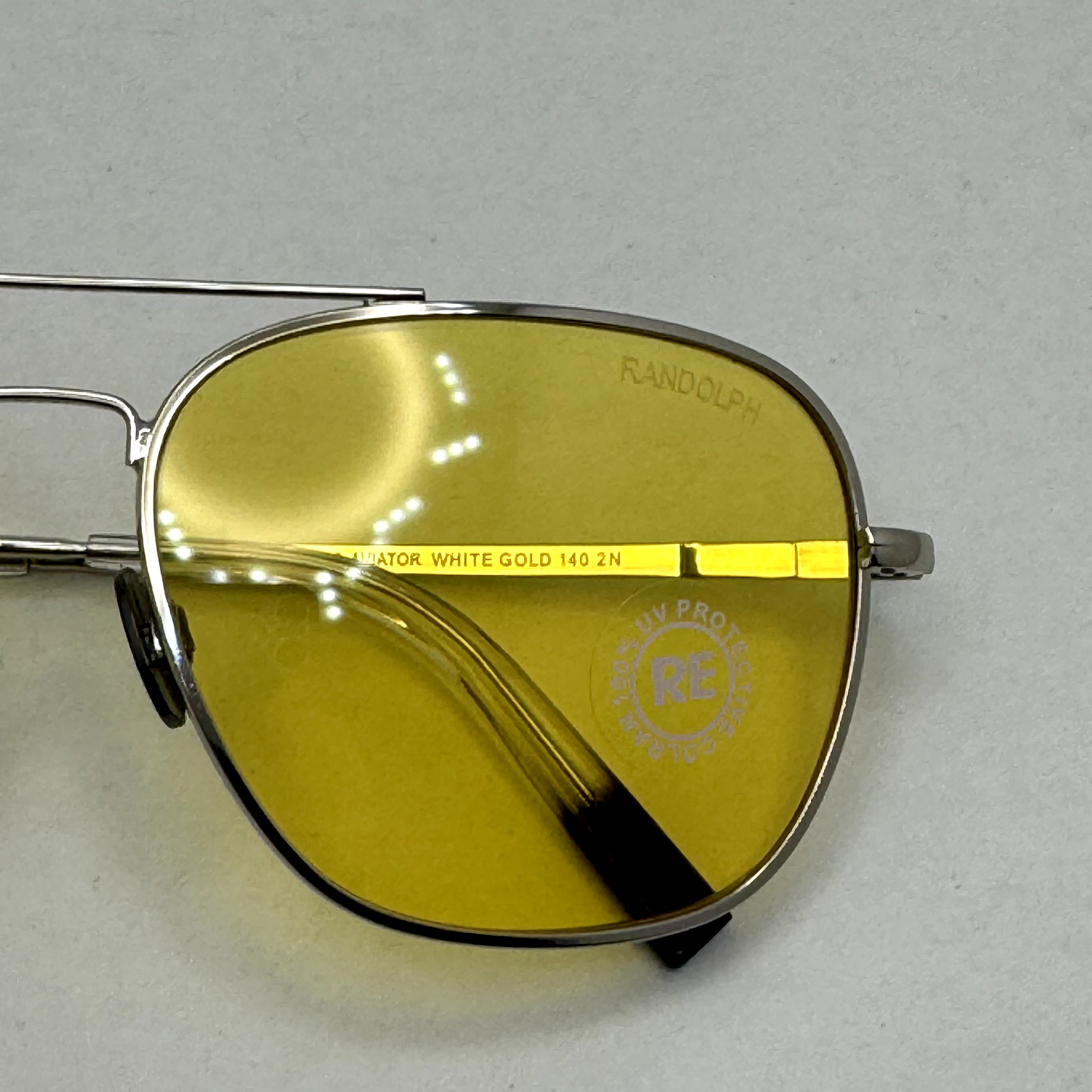 عینک آفتابی و شب خلبانی رندولف شیشه سنگ زرد فریم نقره ای فول پک اصلی RANDOLPH AVIATOR RE 58 24K WHITE GOLD