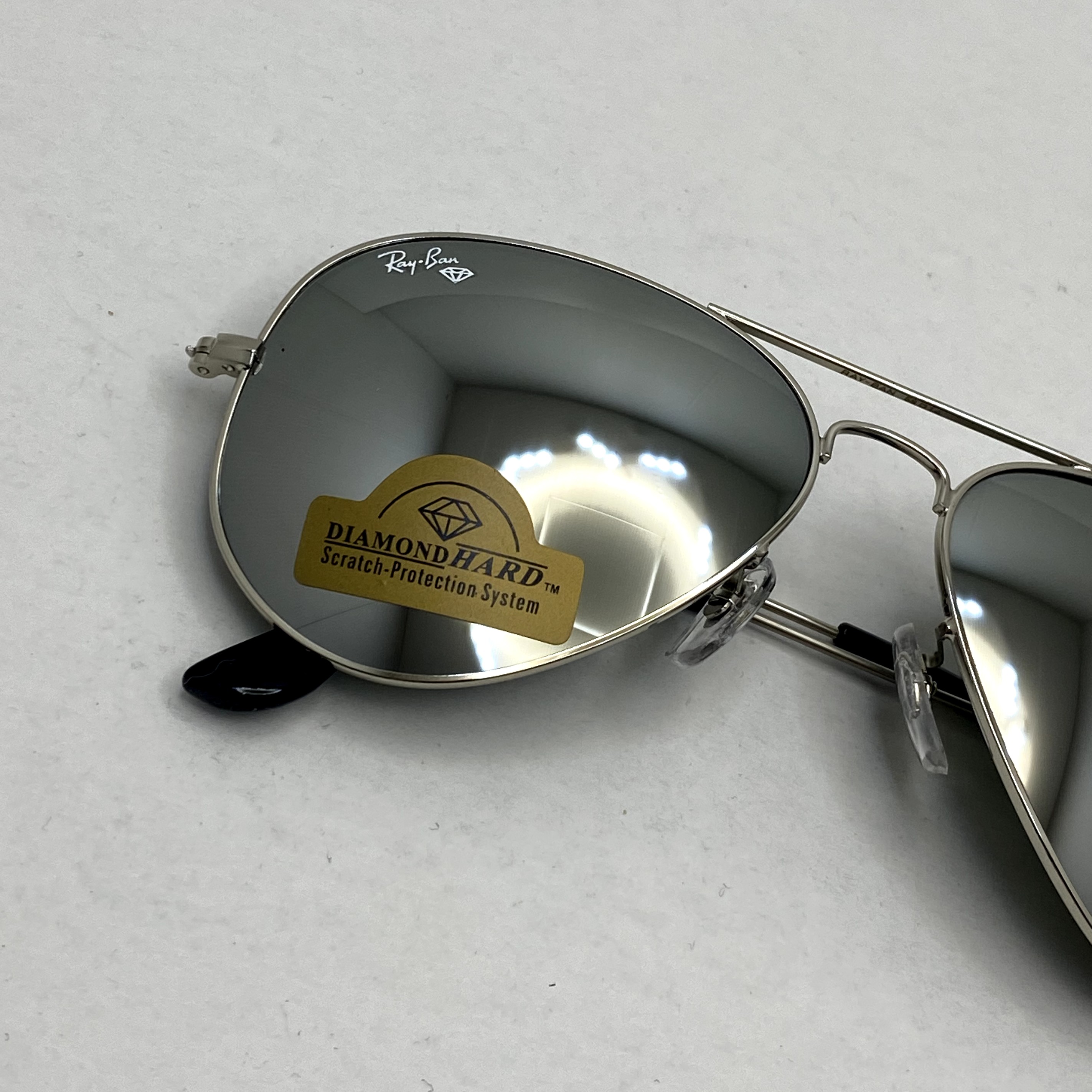 عینک آفتابی خلبانی AVIATOR ریبن rayban شیشه سنگ ایتالیایی آینه ای فریم نقره ای سایز 3025 فول پک
