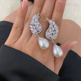 گوشواره زنانه طرح پاپیون نگین و مروارید تنوع طرح رنگ کاملا ثابت کد tj (پس کرایه)