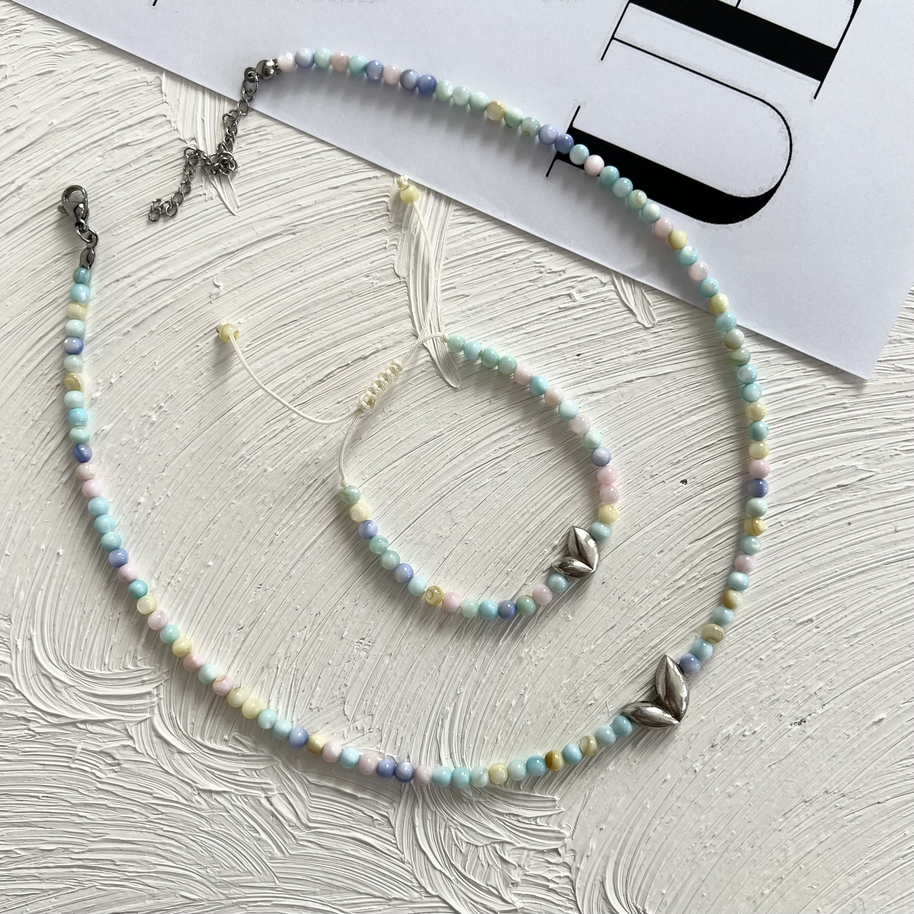 گردنبند و دستبند قلب دفرمه نقره عیار 925 با سنگ پاستیلی