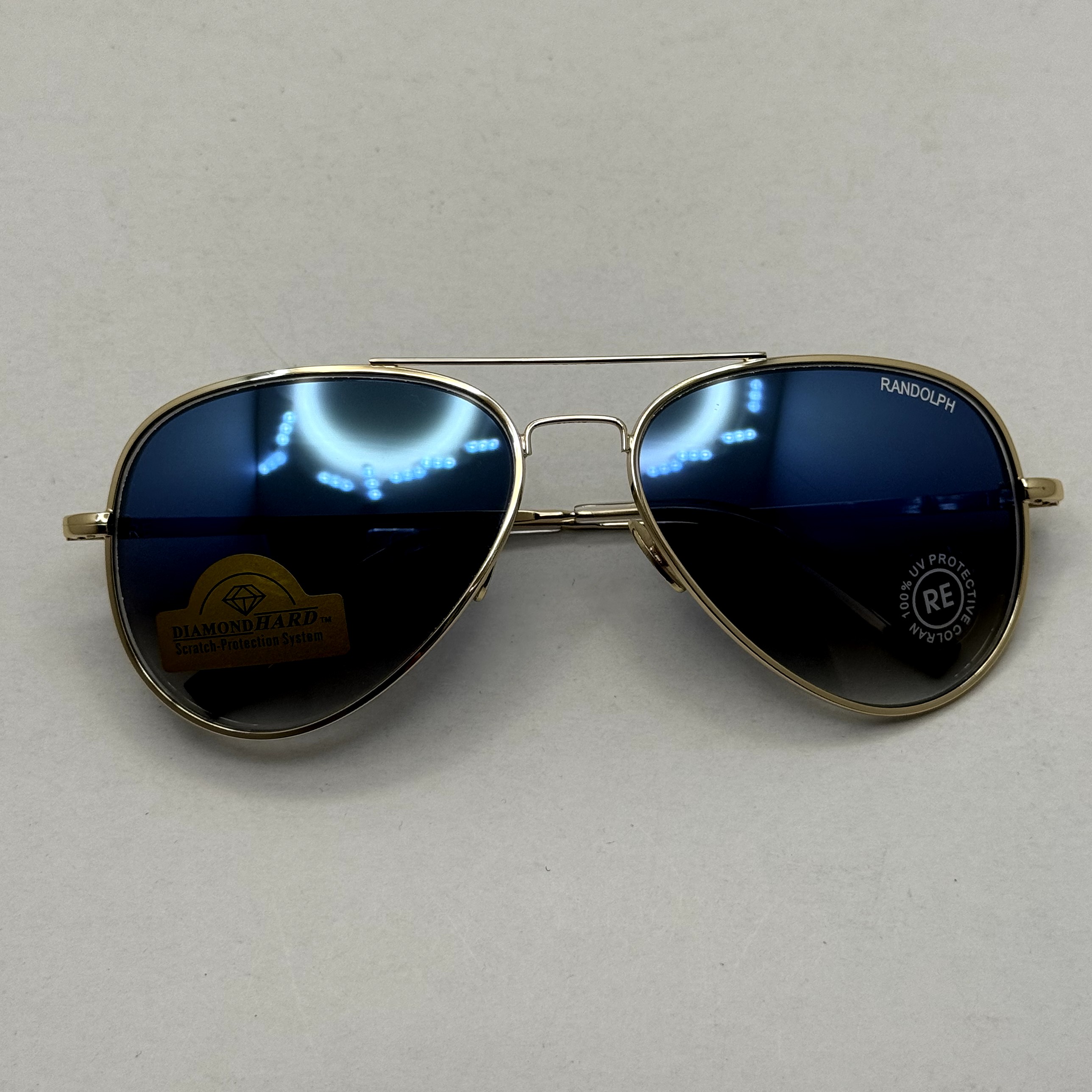عینک آفتابی و شب خلبانی رندولف شیشه سنگ مدل کانکورد آبی فریم طلایی فول پک RANDOLPH CONCORD CR 231 24K GOLD (ارسال
